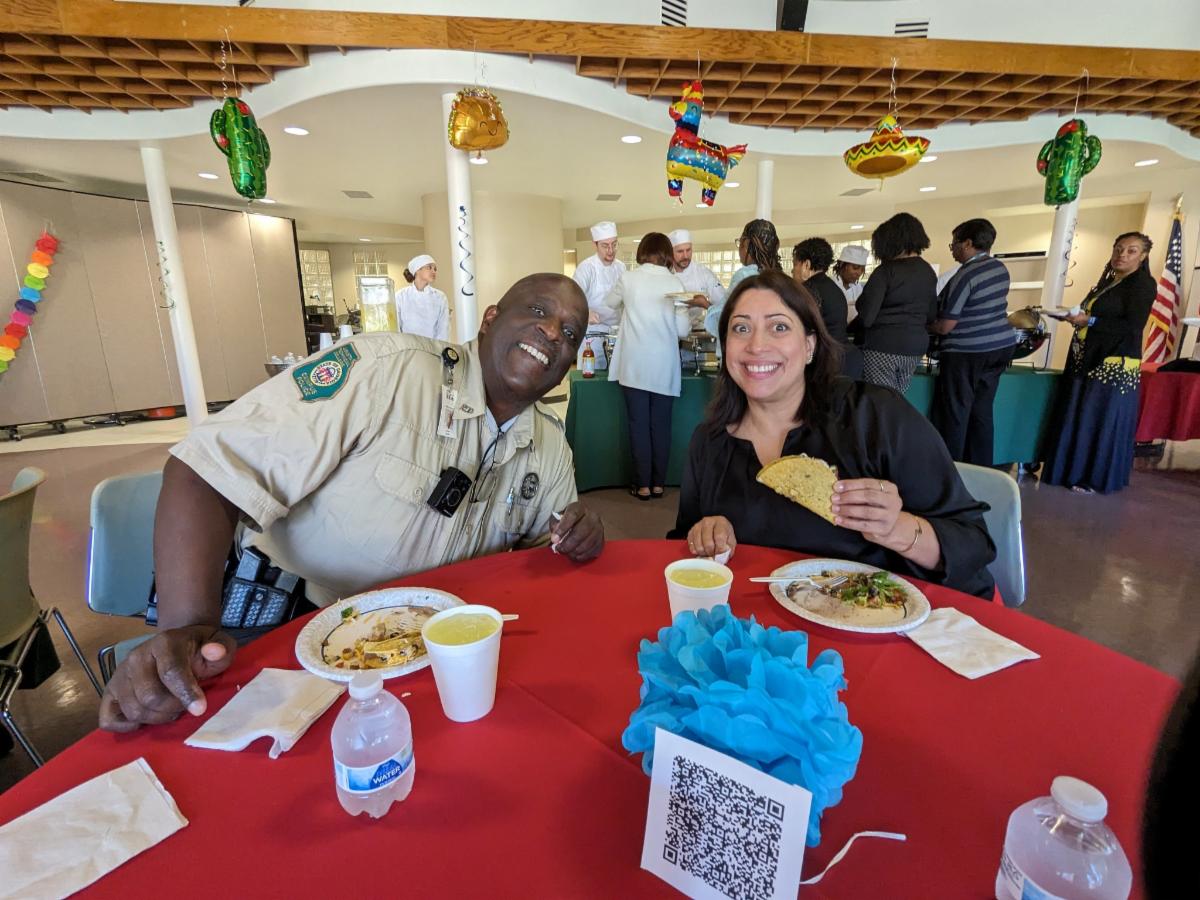 Campus Police Officer Freddie Gavin sits with Student Affairs Coordinator and VA Certifying Official Migdaliz Berrios at the Foundation's Ice Cream Sundae Monday.